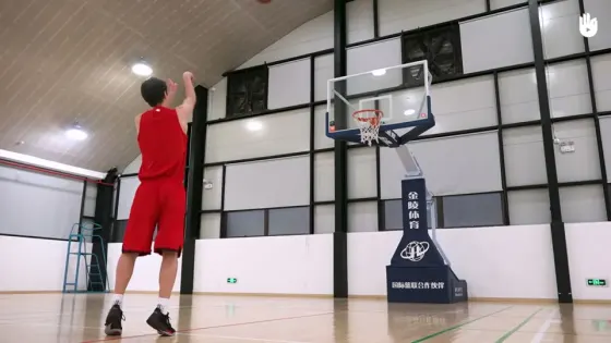 A basketball creator practising a free throw